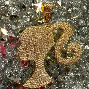 Blinged out Barbie pendant. Gold